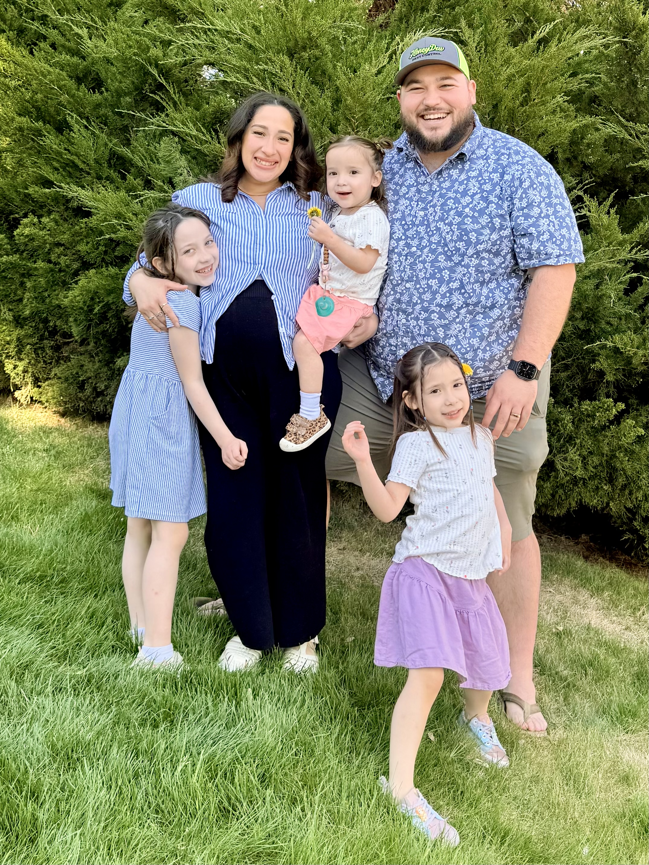 Austin Miller with his family outdoors.
